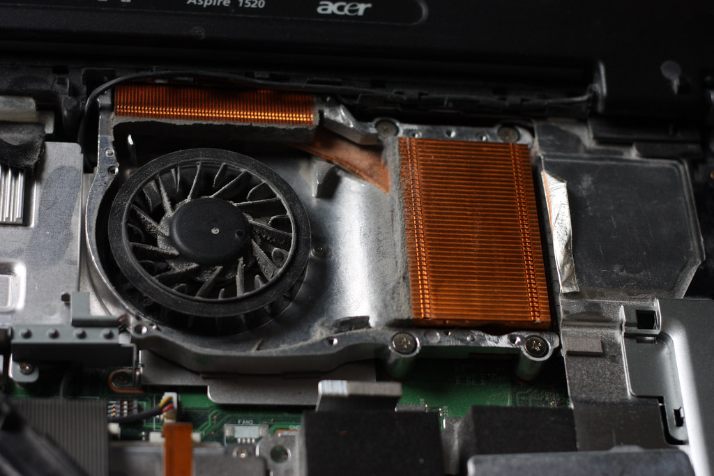A laptop with overheating vents and dust accumulation.