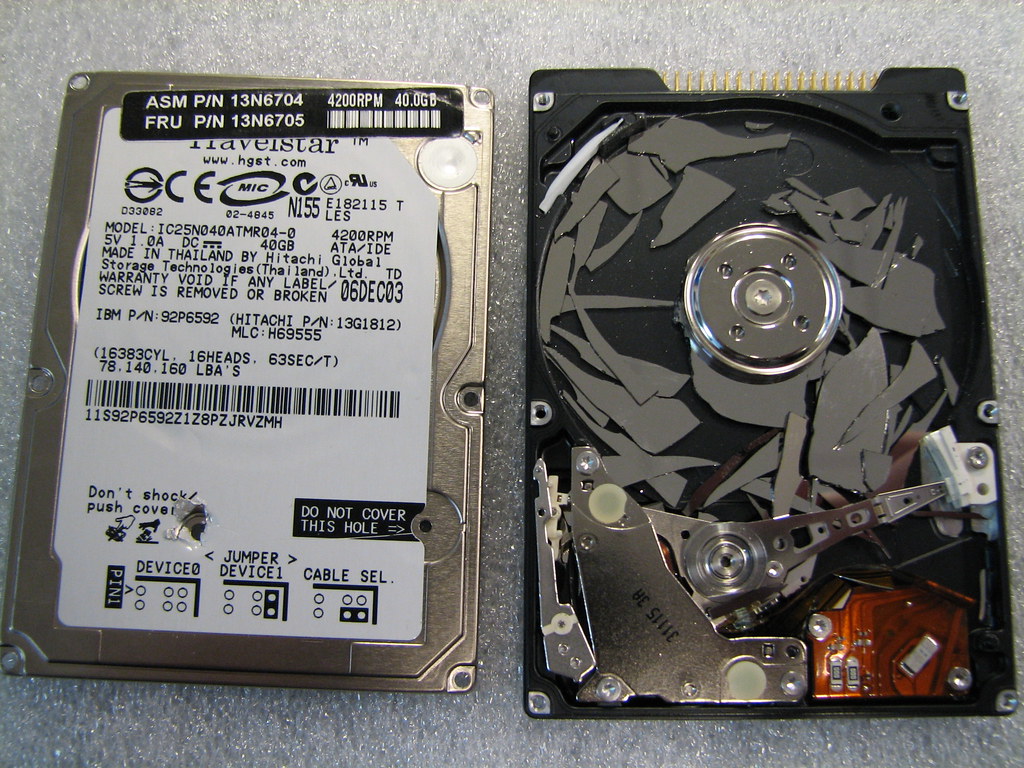 Hard drive with a progress bar showing data recovery.