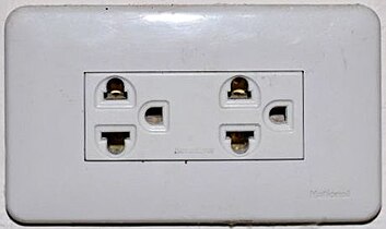 Power outlet with a plug and a crossed-out power symbol.